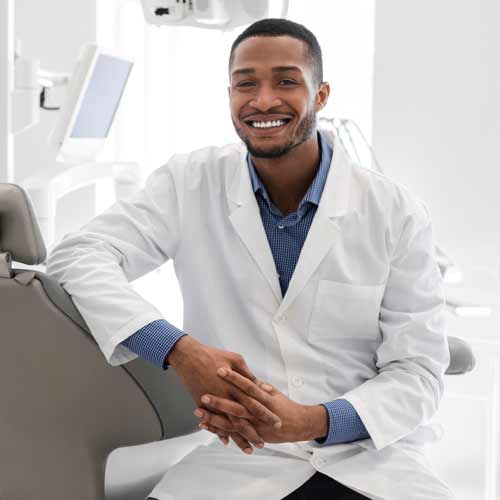 Male dentist smiling